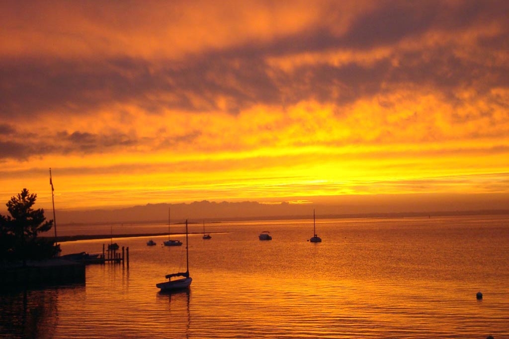 Boat on Bay at Sunset